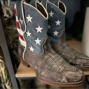 Red white and blue cowgirl  boots. Bought in Nashville. Came distressed looking.